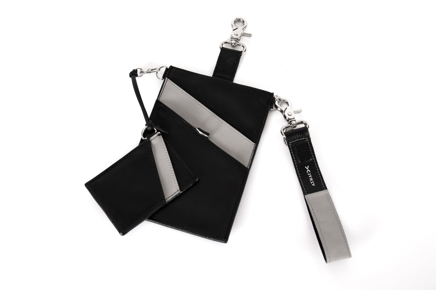 Black and gray, vegan leather phone pouch with a black and gray, vegan leather magnetic wristlet key chain and a black and gray removable three pocket wallet