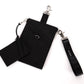 A black vegan leather phone pouch with a black vegan leather magnetic wristlet key chain and a black removable three pocket wallet.